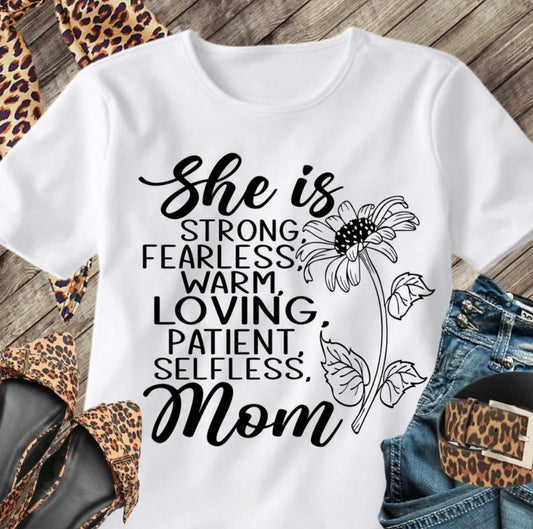 She Is Mom” Graphic Tee – A Tribute to Her Strength and Love